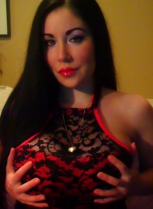 Sweet Krissy: Busty Sweet Krissy shows off her big juicy tits as she strips out of her red and black lace skimpy outfit