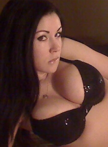 Sweet Krissy: Horny Sweet Krissy teases with her big juicy tits in bed wearing a matching black bra and g-string
