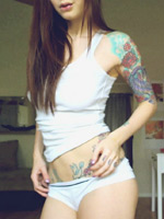 Ivy Snow pouring baby oil on her body on her webcam
