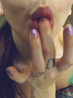 Ivy Snow pouring baby oil on her body on her webcam