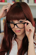 Ivy wears a tight leather skirt and suspenders that she strips off and masturbates with her toy