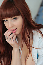 Ivy wears a tight leather skirt and suspenders that she strips off and masturbates with her toy