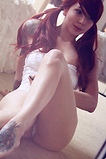 Ivy Snow slowly undresses from her sexy white lace lingerie in front of a mirror