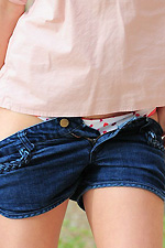 Kamili gets rid of her short shorts and a cute pink shirt to let her undies slide down her long legs