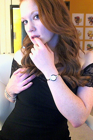Lucy Ohara wears a hot black dress and fishnets while she cums hard with her dildo
