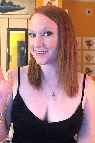 Lucy Ohara has some fun with her red diablo dildo while on her bed