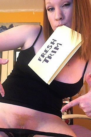 Lucy Ohara has some fun with her red diablo dildo while on her bed