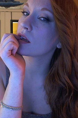 Lucy Ohara spreads her perfect body to reveal her shaved lips and natural red pubic hair
