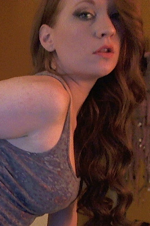 Lucy Ohara spreads her perfect body to reveal her shaved lips and natural red pubic hair