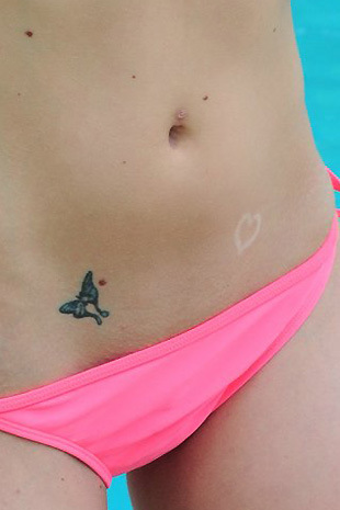 Madison Lain strips off her pink bikini and brings her black dildo out to play