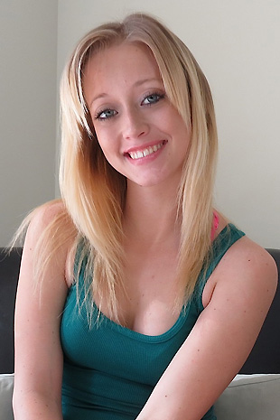 Madison Lain strips out of her casual clothes on her love seat and strokes her petite body