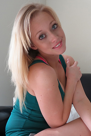 Madison Lain strips out of her casual clothes on her love seat and strokes her petite body