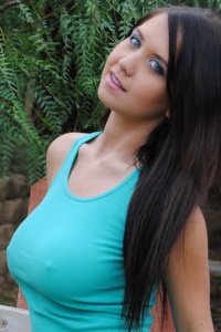 Chubby Girls: Chrissy pops her melons out of a green top