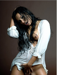 Addictive - Anetta Keys is posing nude in her wet white shirt. Take a look in her deep seductive dark eyes and and let yourself be captivated by her sensual moves.