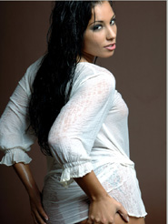 Addictive - Anetta Keys is posing nude in her wet white shirt. Take a look in her deep seductive dark eyes and and let yourself be captivated by her sensual moves.