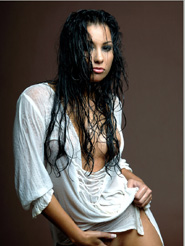 Addictive - Anetta Keys is posing nude in her wet white shirt. Take a look in her deep seductive dark eyes and and let yourself be captivated by her sensual moves.