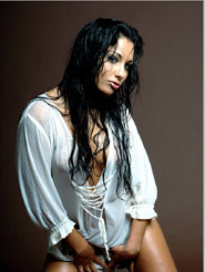 Addictive - Anetta Keys is posing nude in her wet white shirt. Take a look in her deep seductive dark eyes and and let yourself be captivated by her sensual moves.