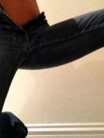 Anastasia Harris plays with her tight jeans and peels them off