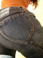 Anastasia Harris plays with her tight jeans and peels them off