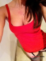 Anastasia Harris peels off her red dress and plays with her stockings