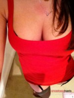 Anastasia Harris peels off her red dress and plays with her stockings