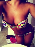 Gracie Lewis plays about at home in her bikini