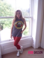 Jodie Gasson strips from her rock and roll shirt and tight red pants