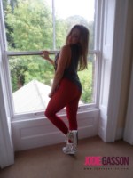 Jodie Gasson strips from her rock and roll shirt and tight red pants