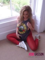 Jodie Gasson strips from her rock and roll shirt and tight red pants