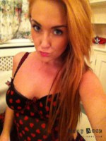 Lucy Anne strips at home from her heart print bodysuit and plays with her red stockings