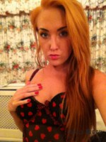 Lucy Anne strips at home from her heart print bodysuit and plays with her red stockings