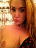 Lucy Anne strips at home from her heart print bodysuit and plays with her red stockings