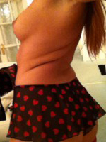 Lucy Anne strips at home from her heart print bodysuit and plays with her red stockings