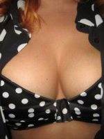 Lucy V shows off her busty breats from her polka dot outfit