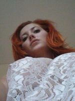 Lucy V peels off her white lingerie at home