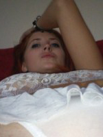 Lucy V peels off her white lingerie at home
