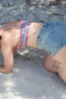 Mellisa Clarke strips from her boob tube and shorts at the beach