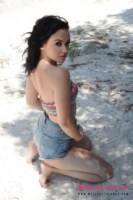 Mellisa Clarke strips from her boob tube and shorts at the beach