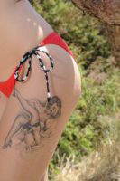 Mellisa Clarke strips from her red bikini on the beach