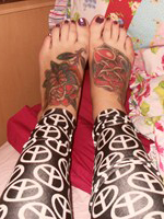 Mellisa Clarke plays about in her bedroom in just her peace sign leggings
