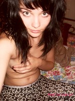 Mellisa Clarke plays about in her bedroom in just her peace sign leggings