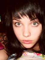 Mellisa Clarke plays about in her bedroom in just her peace sign leggings