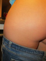 Tommie Jo peels off her cute top and denim shorts with no panties to get in the way