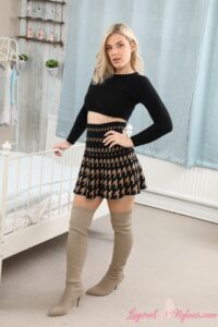 Layered-Nylons Asha Evans in a plaid miniskirt and thigh high boots