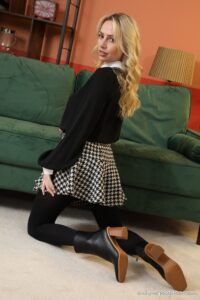 Only-Opaques Holly Gibbons in a plaid miniskirt and black pantyhose
