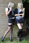 Two sexy blondes in college uniforms strip as they fight!